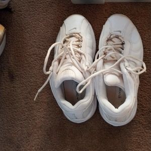 White silver trim Nike training tennis shoes